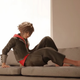 Sora on a couch with no shoes one, showing his feet off.
